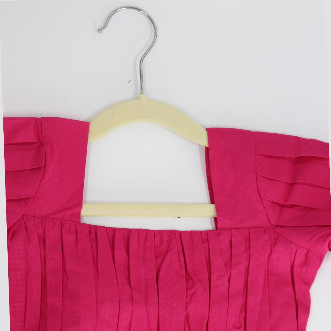 Vibrant Pink Dress with Black Bow Accent
