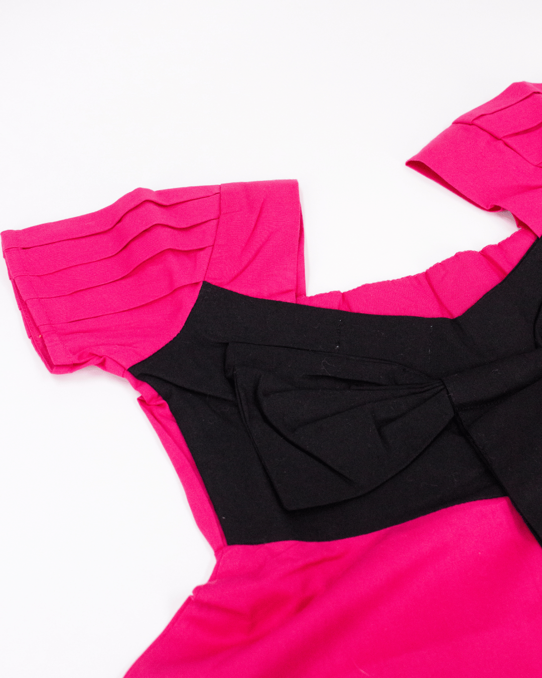 Vibrant Pink Dress with Black Bow Accent